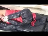 02:40 Min. video with Alina tied and gagged in red shiny shorts and a nylon cagoule