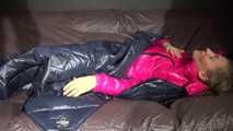 Watching sexy Sandra wearing a sexy pink shiny nlon rain pants and a shiny nylon pink down jacket nestle down in a down cover (Video)