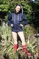 SEXY MARA wearing only a darkblue rain jacket and rubber boots while examining the garden and being sprinkled with water out of the garden hose (Pics)