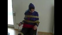 3sets of short videos with Katharina tied and gagged and hooded on a chair wearing shiny nylon rainwear (Video)