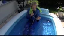 Pia ties and gagges herself in a small swimming pool wearing sexy lightblue downwear (Video)