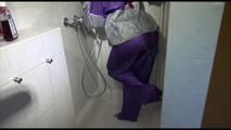 Mara wearing a sexy purple/silver pvc combination tied and gagged on a shower (Video)