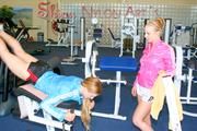 Katharina and Jenny during their workout in the fitness center wearing sexy shiny nylon shorts and rain jackets (Pics)