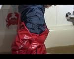 Mara wearing a sexy shiny nylon shorts and an odlschool rain jacket while taking a bath in mud (Video)