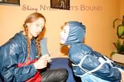 Stella tied and gagged by Leonie both wearing sexy shiny nylon rainwear (Pics)