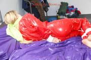 Samantha tied and gagged on bed wearing a shiny red PVC sauna suit (Pics)