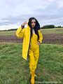 Miss Amira on the road in a Frisian mink, yellow rain dungarees and rubber boots