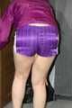 Pia enjoying a cupboard full of shiny nylon clothes trying on purple shiny nylon shorts and rain jacket (Pics)