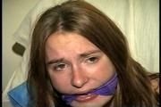 24 Yr OLD CRAFTER IS BLINDFOLDED, CLEAVE GAGGED WITH WRAP AROUND VET TAPE, BALL-TIED,CROTCH ROPED, BAREFOOT, TOE-TIED, GAG TALKING THROUGH A WET DROOL GAG, HOPS AROUND WEARING A SEXY BIKINI (D70-9)