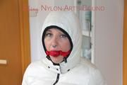 Mara tied and gagged on a chair in the corridor wearing sexy shiny nylon downwear (Pics)