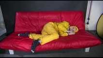 ***MARA*** ties and gagges with cuffs on the sofa wearing a supersexy oldschool yellow rain suit with hood (Video)