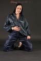 Beautiful black haired archive girl posing in front of the camera for you wearing supersexy darkblue rainwear with zipper (Pics)