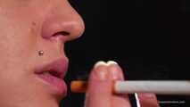 Smoking 100mm Marlboro Red in this closeup video 