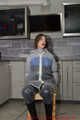 Miss J ziptied in raingear and gagged with stuffed mouth and secured clave gag