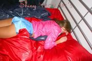 Alina preparing her bed for relaxing and lolling on the bed wearing sexy shiny nylon shorts and a rain jacket (Pics)