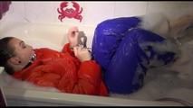 Jill ties and gagges herself in a bath tub for having an extraordinary experience wearing a sexy lightblue rainpants and an orange down jacket (Video)
