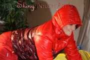 Watching sexy Jill wearing a sexy red shiny nylon rain pants and a red/ purple downjacket lolling in her bed (Pics)