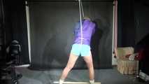 Watching sexy Pia wearing a sexy lightblue shiny nylon shorts and a purple rain jacket being tied and gagged with ropes and a ball gag overhead (Video)