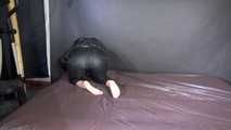 Watching sexy SONJA wearing a black rain pants and a black shiny nylon down jacket preparing bed (Video)