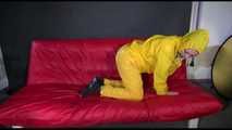 ***MARA*** ties and gagges with cuffs on the sofa wearing a supersexy oldschool yellow rain suit with hood (Video)