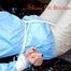 Pia tied and gagged on bed wearing a shiny lightblue/offwhite PVC combination (Pics)