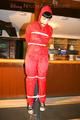Jill tied and gagged on a pillar wearing a shiny red rainwear (Pics)