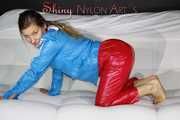 Watching sexy Sandra putting on a very special red shiny nylon pant posing and lolling for you (Pics)