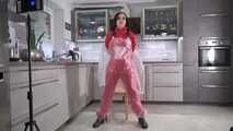 Miss Amira in red nylon rain gear and tranparent rain suit