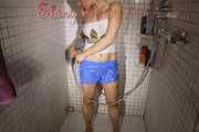 SEXY SANDRA in the shower with a sexy lightblue shiny nylon shorts and a top (Pics)