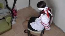 Jasmin roped to chair 2/2