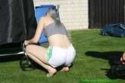 Watch Chloe enjoying her shiny nylon Shorts outside at a sunny Day