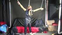 Sexy Sandra wearing a sexy black shiny nylon jumpsuit being tied and gagged with ropes and a cloth gag overhead (Video)