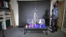 Marie M bound and suspended in shiny nylon down