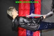 Sonja wearing sexy shiny nylon rainwear sorting clothe hanger in the studio (Pics)