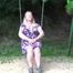 Miri cuffed on a swing