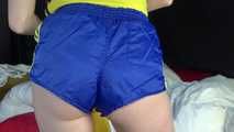 *** Sexy MIA wearing a blue shiny nylon shorts and a yellow top during changing the cloths on her bed  (Video)***