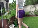 Get a video with Chloe enjoying gardening in her shiny nylon Shorts