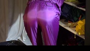 Sonja wearing a sexy purple shiny nylon rainwear combination during reordering the cupboard (Video)