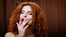 Wild and free girl Yuliya is definitely enjoying a strong 100mm black cigarette