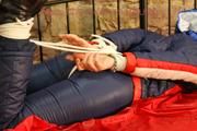 Mara tied, gagged and hooded on a princess bed wearing sexy oldschool downwear in blue/red/white (Pics)