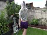 Get a video with Chloe enjoying gardening in her shiny nylon Shorts