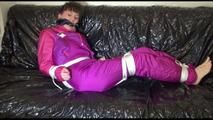 Mara tied and gagged on a sofa wearing sexy pink/purple downwear (Video)