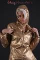 Blonde archive girl posing in a studio wearing a sexy golden rainwear combination (Pics)