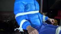 Sexy Pia being tied and gagged with ropes and a cloth gag on a hairdressers chair wearing a sexy blue shiny nylon rainpants and a lightblue downjacket (Video)