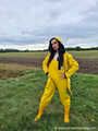 Miss Amira on the road in a Frisian mink, yellow rain dungarees and rubber boots