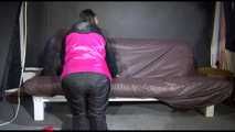 Watching Mara preparing her sofa with shiny nylon cloth wearing a sexy rainwear combination (Video)