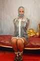 Miss Scarlett bound and gagged in full PVC outfit and transparent raincoat