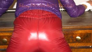 Alina tied and gagged on a commode wearing a shiny red/purple downwear combination (Pics)