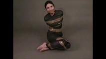 4 short videos in one of an beautiful black haired archive girl tied and gagged on the floor wearing sexy shiny nylon rainwear (Video)