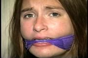 24 Yr OLD CRAFTER IS BLINDFOLDED, CLEAVE GAGGED WITH WRAP AROUND VET TAPE, BALL-TIED,CROTCH ROPED, BAREFOOT, TOE-TIED, GAG TALKING THROUGH A WET DROOL GAG, HOPS AROUND WEARING A SEXY BIKINI (D70-9)